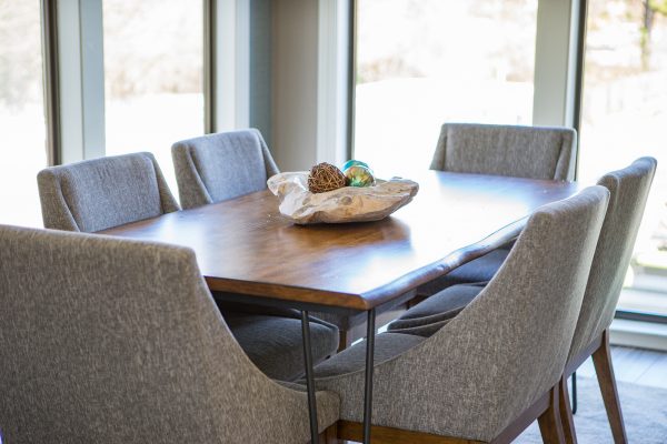 Long table with six chairs perfect for dining, lounging, or coworking