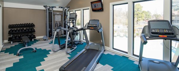 Spacious, 24-hour fitness center with a variety of cardio and strengthening equipment and machinery