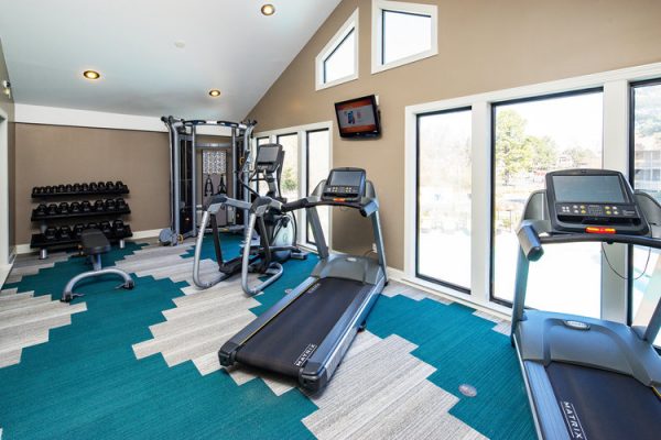Spacious, 24-hour fitness center with a variety of cardio and strengthening equipment and machinery